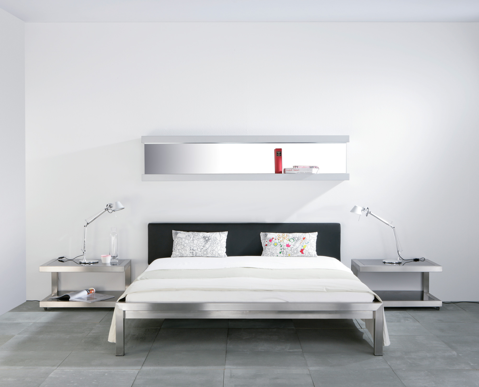 Pure stainless steel bed with upholstered headboard imitation leather black Hans Hansen