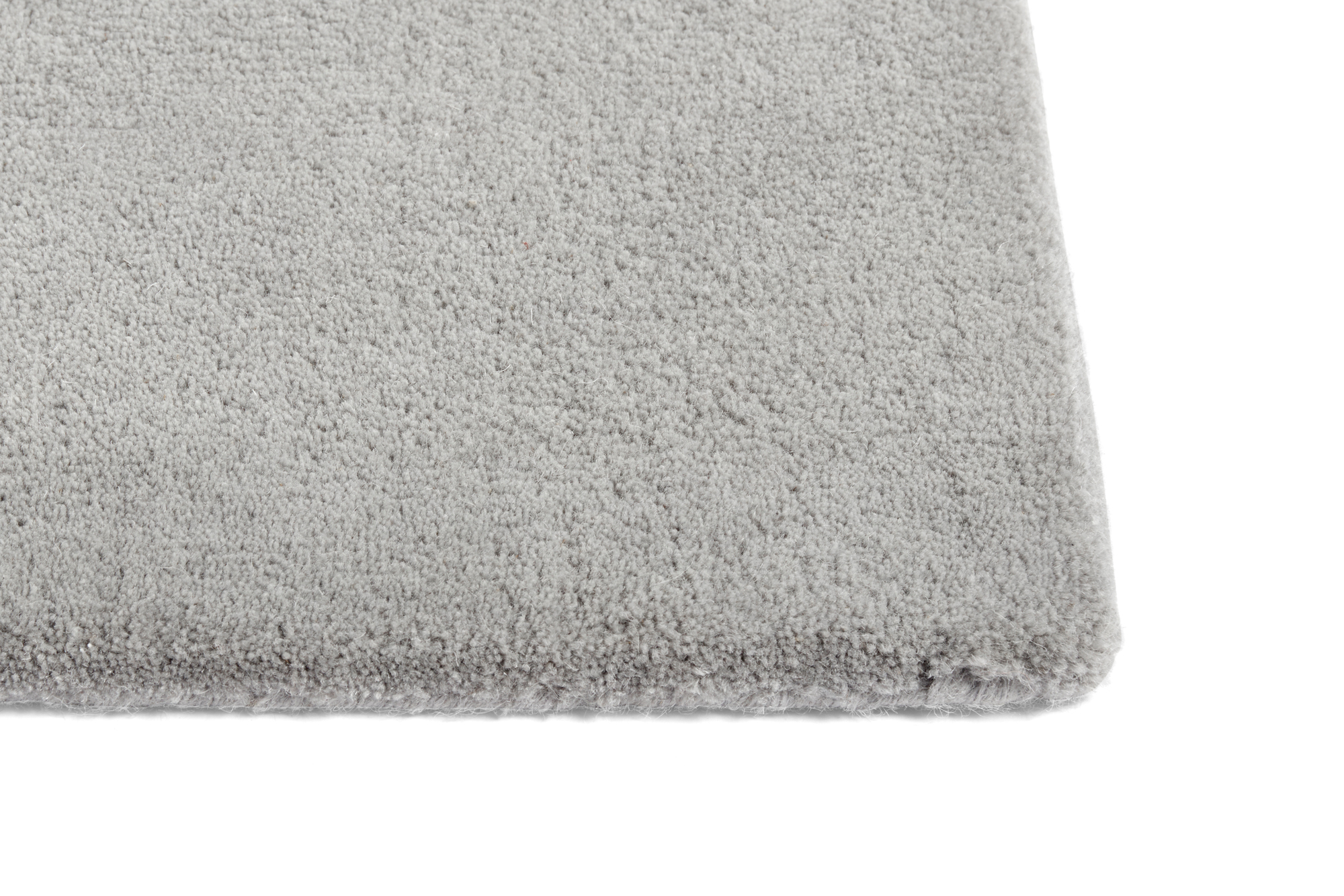 Detailaufnahme des hellgrauen Hay Teppichs "Raw Rug No 2" (240x170 cm) mit weicher Textur.