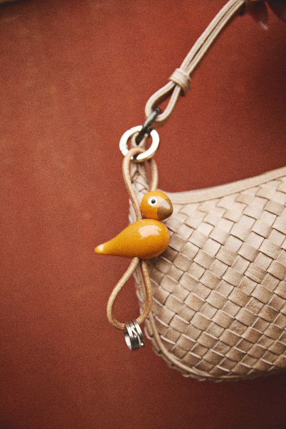 Bird red/orange key ring silver coloured metal with natural leather Kay Bojesen