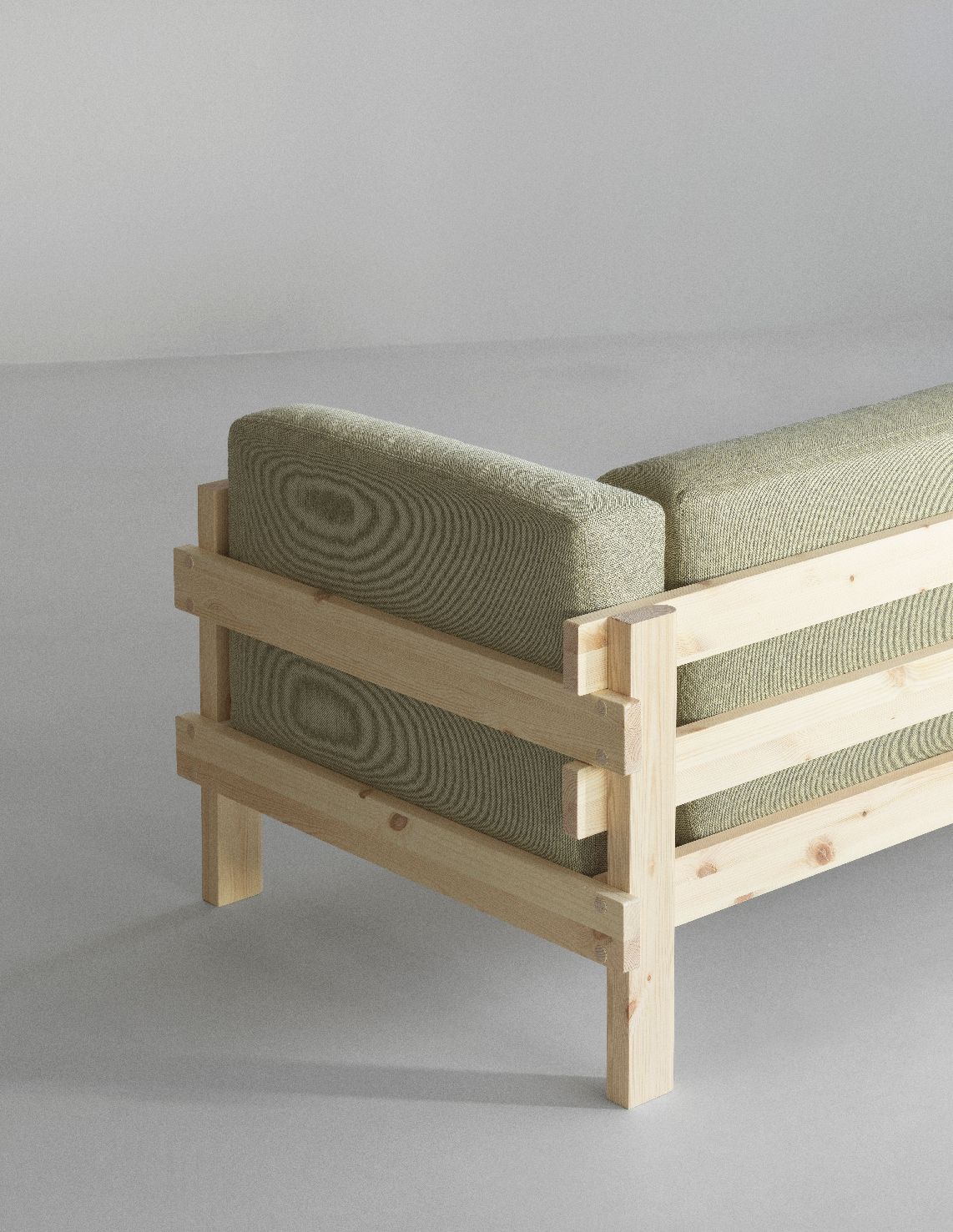 Detailaufnahme des Kube Sofa von Normann Copenhagen mit hellem Holzrahmen und olivgrünen Polsterkissen.