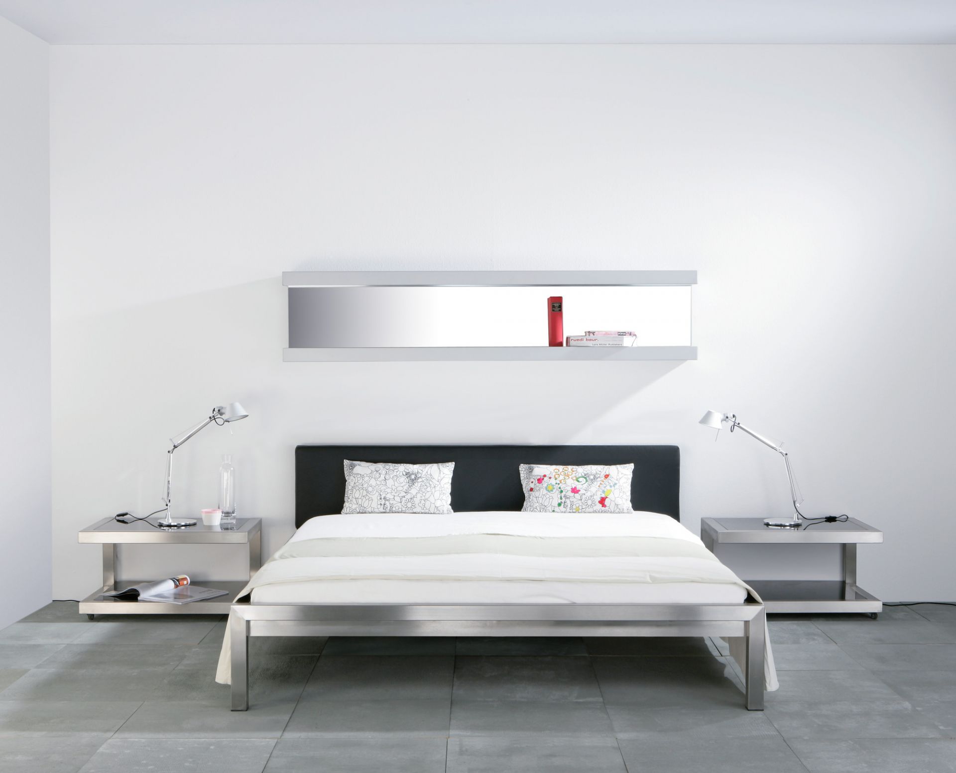 Pure stainless steel bed with upholstered headboard imitation leather black Hans Hansen