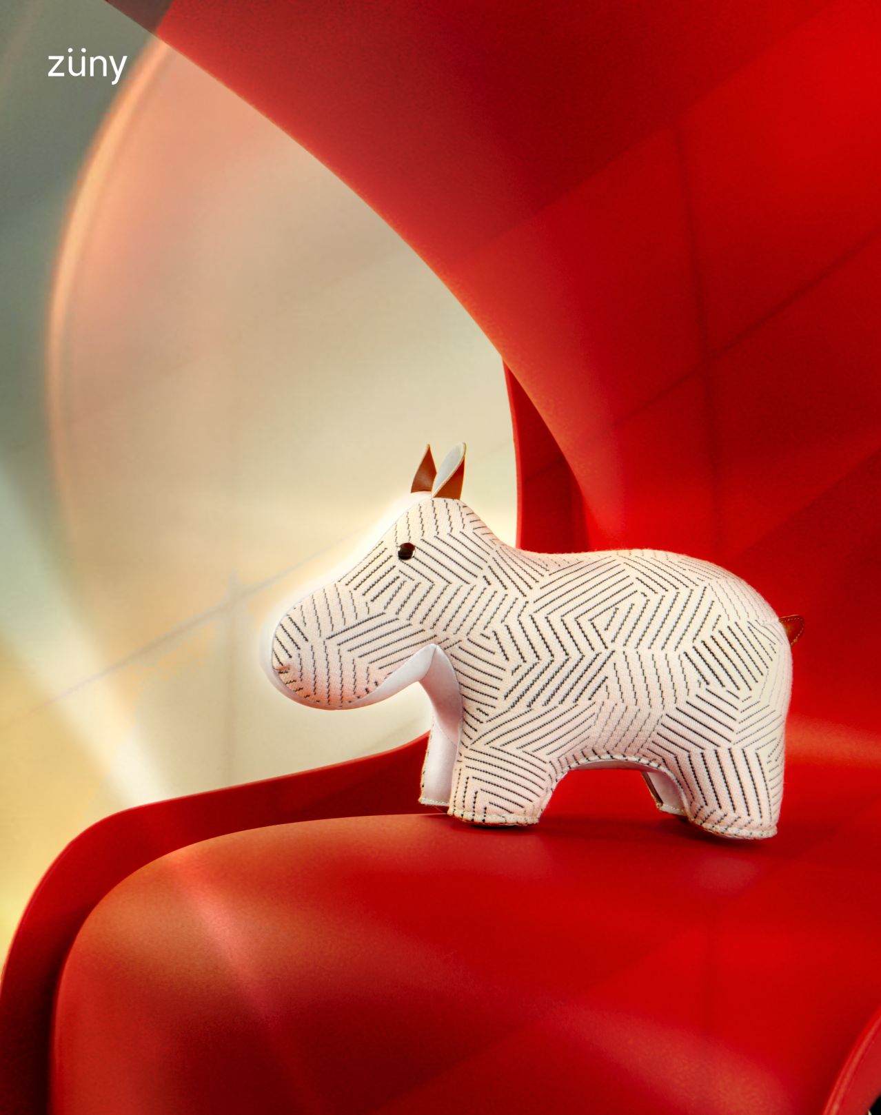 Weißer Züny Hippo Grid Buchstütze aus Stoff mit geometrischem Muster auf rotem Untergrund.