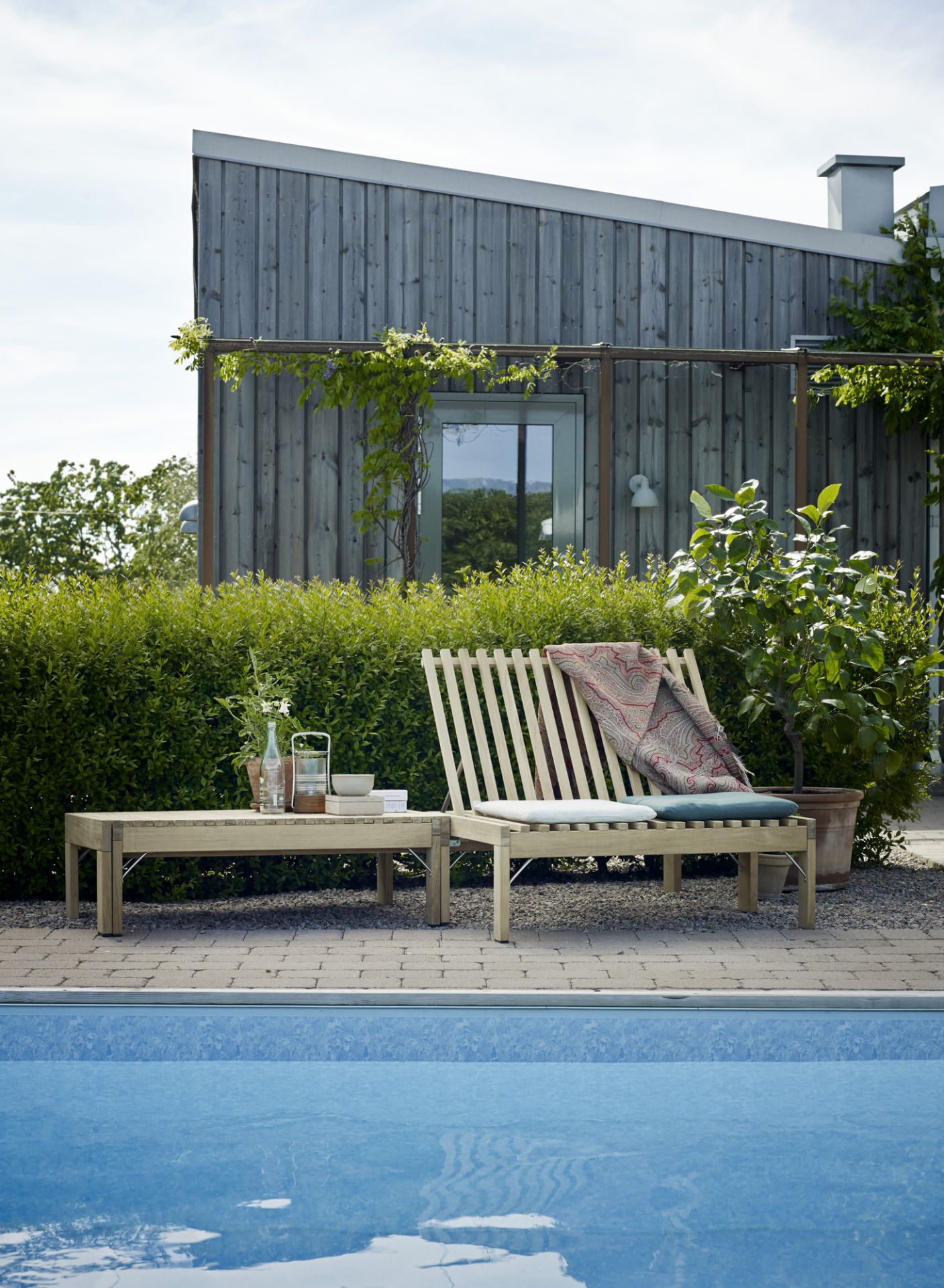 Riviera Lounge Teak with seat cushion Charcoal Outdoor Skagerak by Fritz Hansen